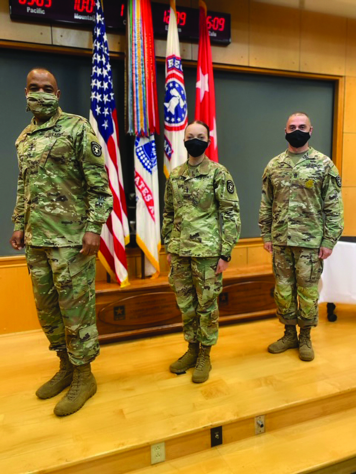 1LT Heather McFarlain represented USAREC HQ OSJA in the historic USAREC Re-Patching Ceremony after 48 years of wearing the original patch design, which was approved on 6 December 1972. Pictured from left to right: Major General Kevin Vereen, 1LT Heather McFarlain, CSM John Foley.